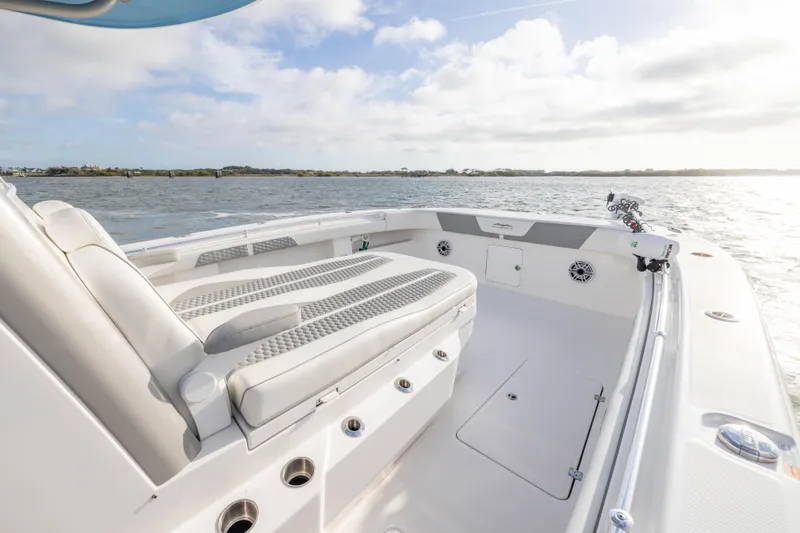 Nordic Blue Yacht Photos Pics 2024 Invincible 35 Catamaran interior with cushioned seating, on a sunny day at sea.