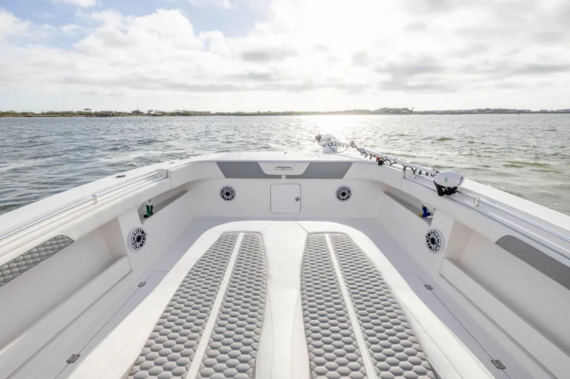 Nordic Blue Yacht Photos Pics 2024 Invincible 35 Catamaran on water, showcasing spacious deck and modern design.