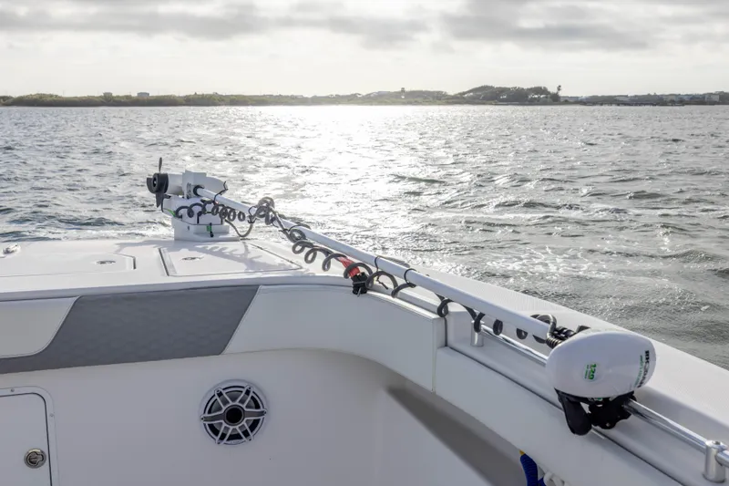 Nordic Blue Yacht Photos Pics 2024 Invincible 35 Catamaran on water, showcasing deck and fishing rod holders.