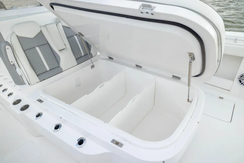 Nordic Blue Yacht Photos Pics 2024 Invincible 35 Catamaran with open storage compartment and cushioned seating.