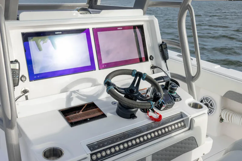 Nordic Blue Yacht Photos Pics 2024 Invincible 35 Catamaran helm with dual Simrad displays and modern controls.