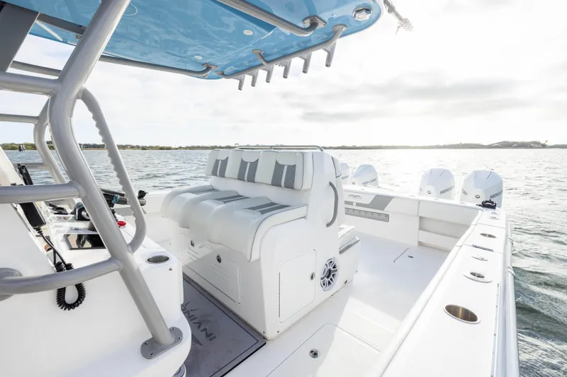 Nordic Blue Yacht Photos Pics 2024 Invincible 35 Catamaran with sleek seating and powerful outboard engines on open water.