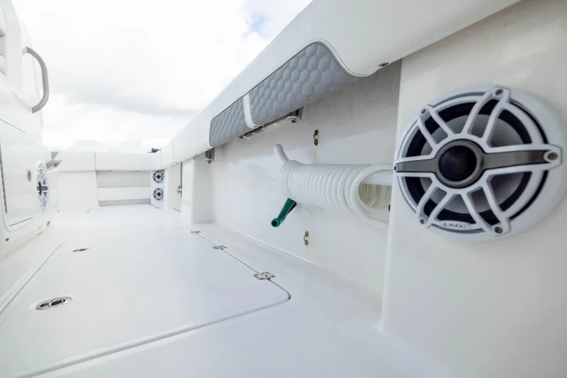 Nordic Blue Yacht Photos Pics 2024 Invincible 35 Catamaran deck with speakers and storage compartments.