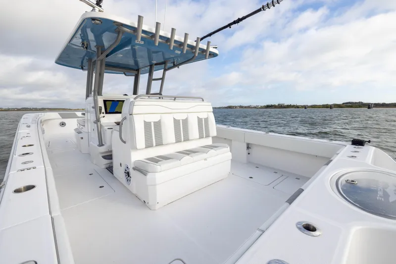 Nordic Blue Yacht Photos Pics 2024 Invincible 35 Catamaran on water, featuring spacious deck and modern seating.