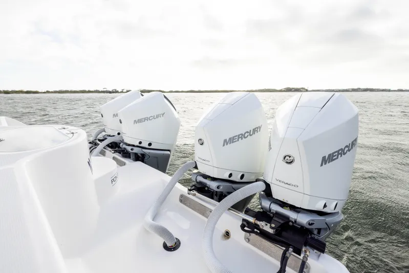 Nordic Blue Yacht Photos Pics 2024 Invincible 35 Catamaran with triple Mercury Verado engines on open water.