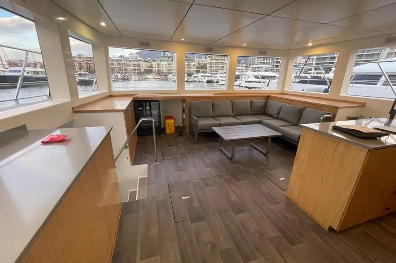 Pilar X Yacht Photos Pics Luxurious interior of 2024 Leeuwin 55 yacht with spacious seating and panoramic windows.
