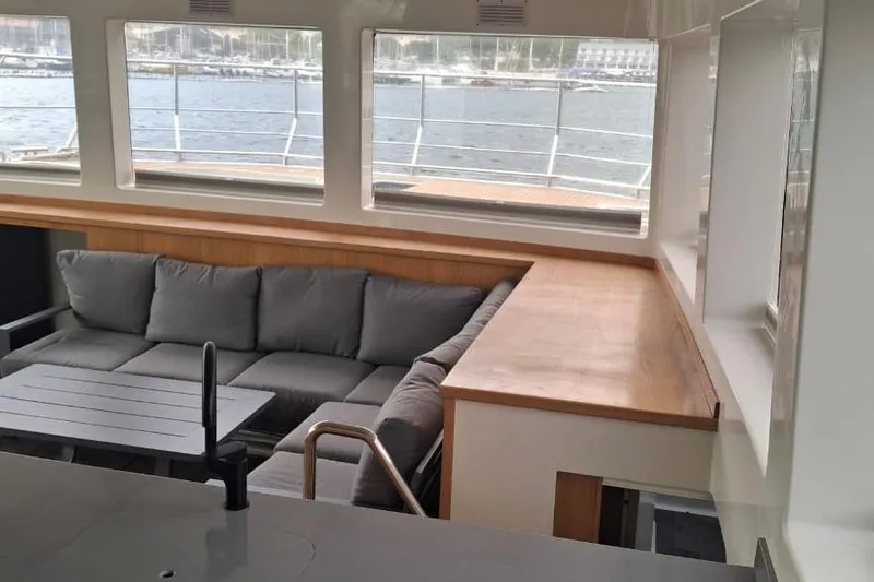 Pilar X Yacht Photos Pics Luxurious interior of 2024 Leeuwin 55 yacht with comfortable seating and ocean view.