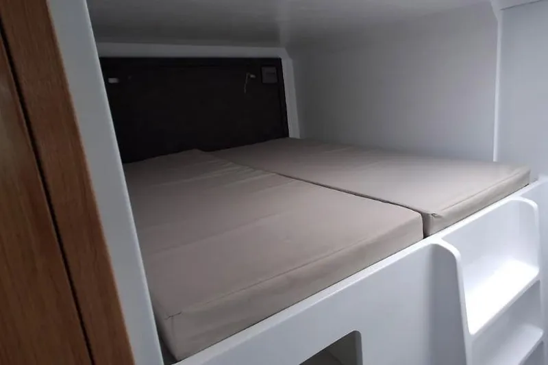 Pilar X Yacht Photos Pics 2024 Leeuwin 55 interior cabin with a comfortable double bed setup.