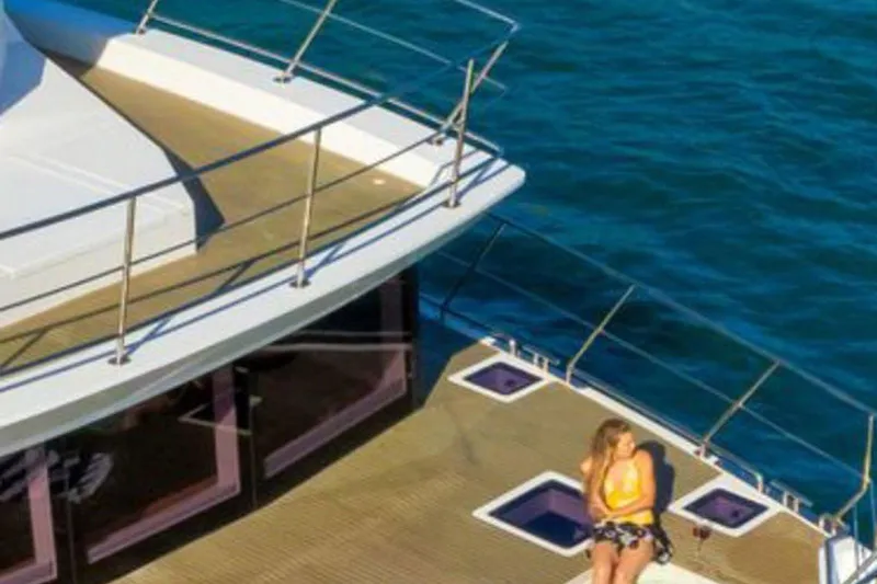 Pilar X Yacht Photos Pics Woman relaxing on Leeuwin 55 yacht, 2024 model.