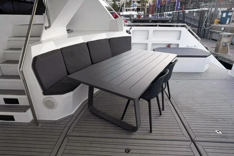 Pilar X Yacht Photos Pics Deck area of Leeuwin 55 yacht, 2024 model, featuring table and seating.