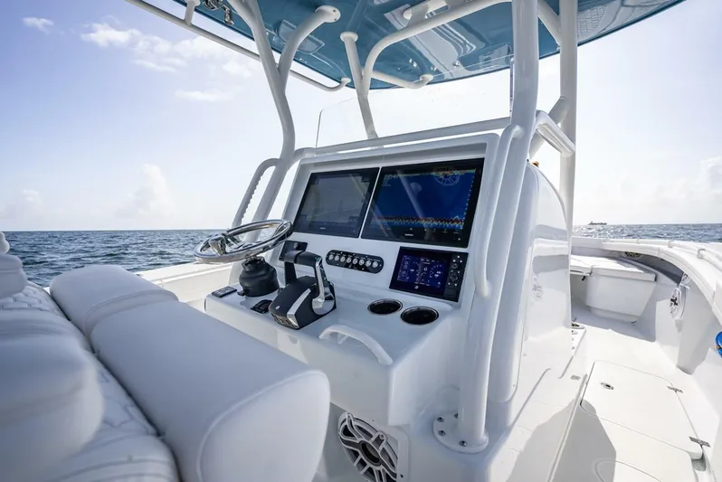 34 Offshore Yacht Photos Pics 2025 Yellowfin 34 Offshore boat console with advanced navigation screens and controls.