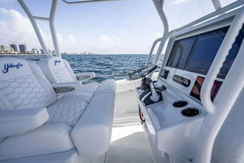 34 Offshore Yacht Photos Pics 2025 Yellowfin 34 Offshore boat interior with modern controls and luxurious seating.