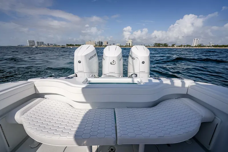 34 Offshore Yacht Photos Pics 2025 Yellowfin 34 Offshore boat with triple Mercury engines on open water.