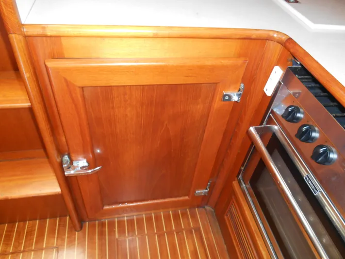 Balmy Yacht Photos Pics Wooden cabinetry and stove in 1999 Grand Banks 38 Eastbay EX yacht kitchen.