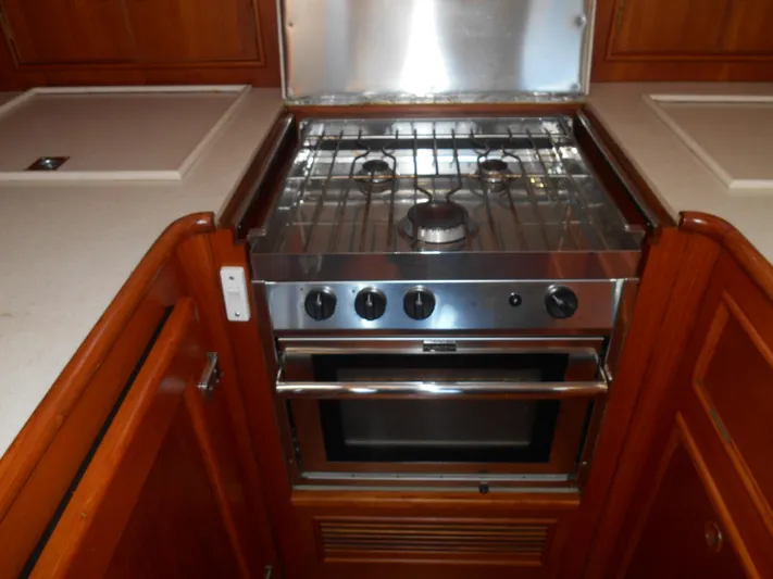 Balmy Yacht Photos Pics 1999 Grand Banks 38 Eastbay EX yacht kitchen with stove and oven.