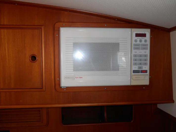 Balmy Yacht Photos Pics Built-in microwave in 1999 Grand Banks 38 Eastbay EX yacht interior.