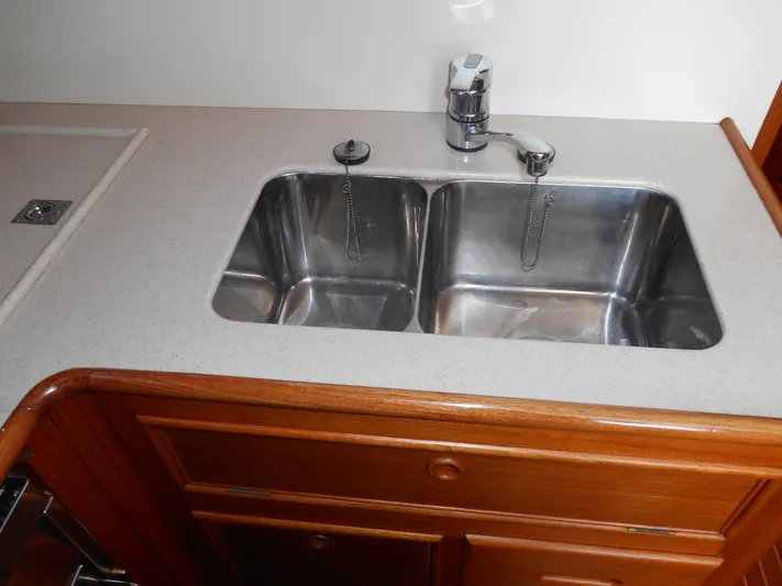 Balmy Yacht Photos Pics Stainless steel double sink in 1999 Grand Banks 38 Eastbay EX yacht kitchen.