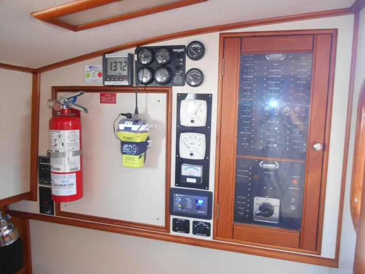 Balmy Yacht Photos Pics Control panel of 1999 Grand Banks 38 Eastbay EX with gauges and fire extinguisher.