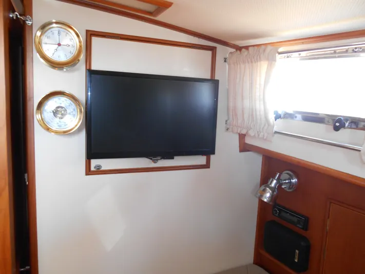 Balmy Yacht Photos Pics Interior of 1999 Grand Banks 38 Eastbay EX with TV and nautical instruments.