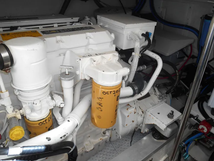 Balmy Yacht Photos Pics Engine room of 1999 Grand Banks 38 Eastbay EX with visible components and filters.
