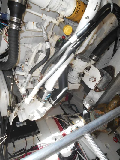 Balmy Yacht Photos Pics Engine compartment of 1999 Grand Banks 38 Eastbay EX with visible hoses and components.
