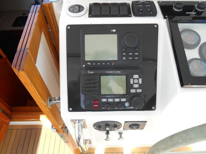 Balmy Yacht Photos Pics 1999 Grand Banks 38 Eastbay EX helm with navigation controls and gauges.