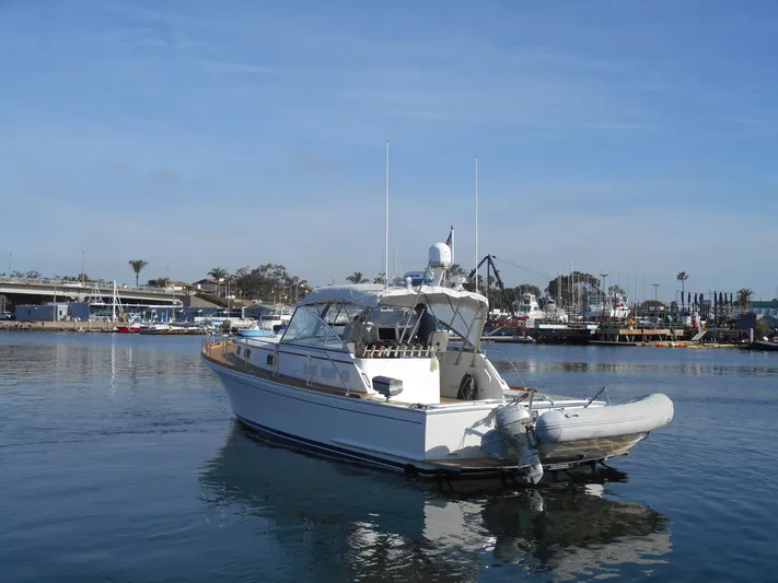 Balmy Yacht Photos Pics 1999 Grand Banks 38 Eastbay EX yacht docked in a marina, clear sky background.