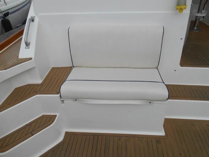 Balmy Yacht Photos Pics White cushioned seat on 1999 Grand Banks 38 Eastbay EX boat deck.