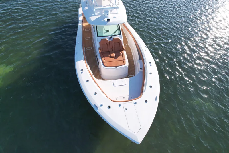  Yacht Photos Pics 2019 Scout 420 LXF boat on water, aerial view, sleek design, luxury seating.