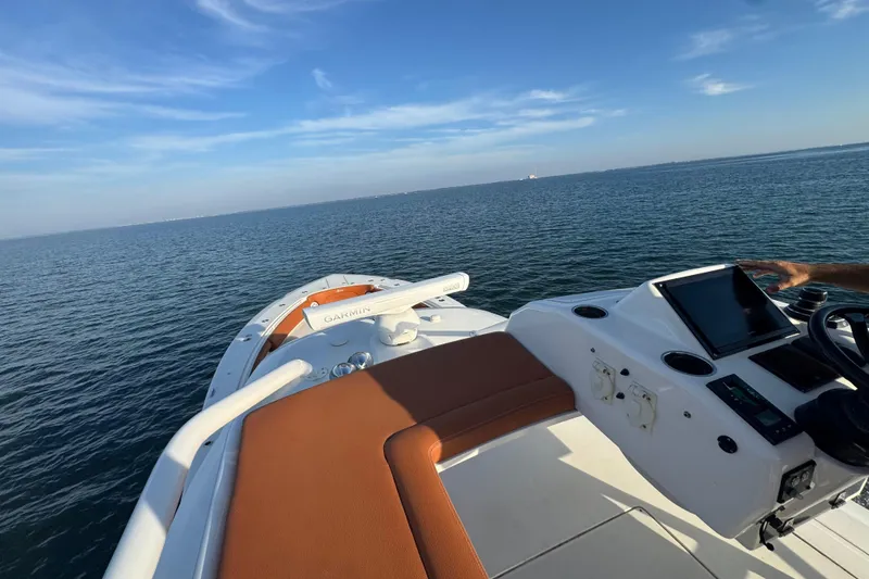  Yacht Photos Pics 2019 Scout 420 LXF boat on open water with clear blue sky.