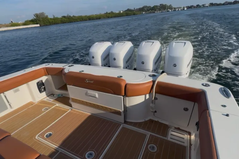  Yacht Photos Pics 2019 Scout 420 LXF boat with quad engines cruising on open water.