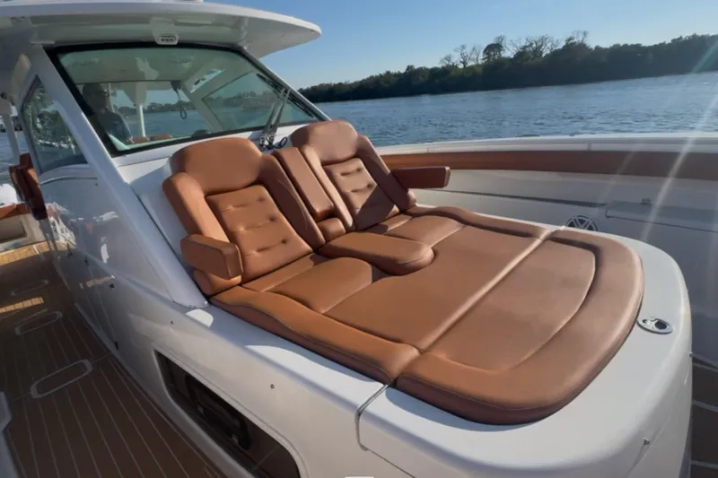  Yacht Photos Pics Luxurious seating on 2019 Scout 420 LXF boat, with scenic water view.