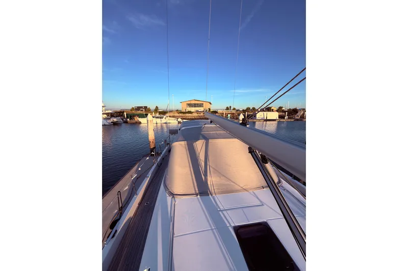 One Five Yacht Photos Pics Beneteau Oceanis Yacht 54, 2022 model, docked at marina during sunset.