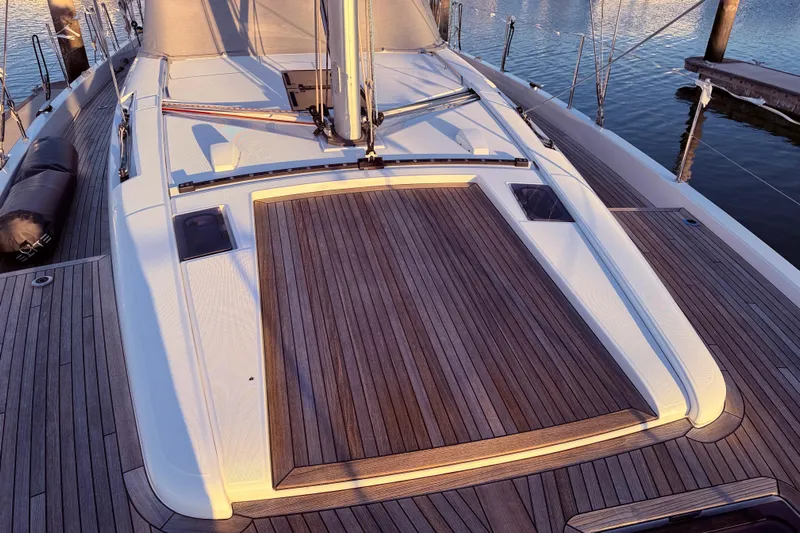 One Five Yacht Photos Pics Deck of 2022 Beneteau Oceanis Yacht 54 with elegant wood finish.