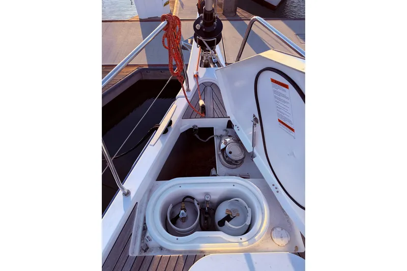 One Five Yacht Photos Pics Beneteau Oceanis Yacht 54 (2022) deck view with open storage compartment.