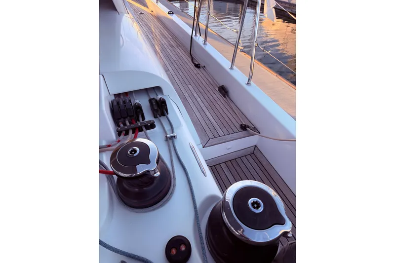 One Five Yacht Photos Pics Deck view of 2022 Beneteau Oceanis Yacht 54, showcasing winches and teak flooring.