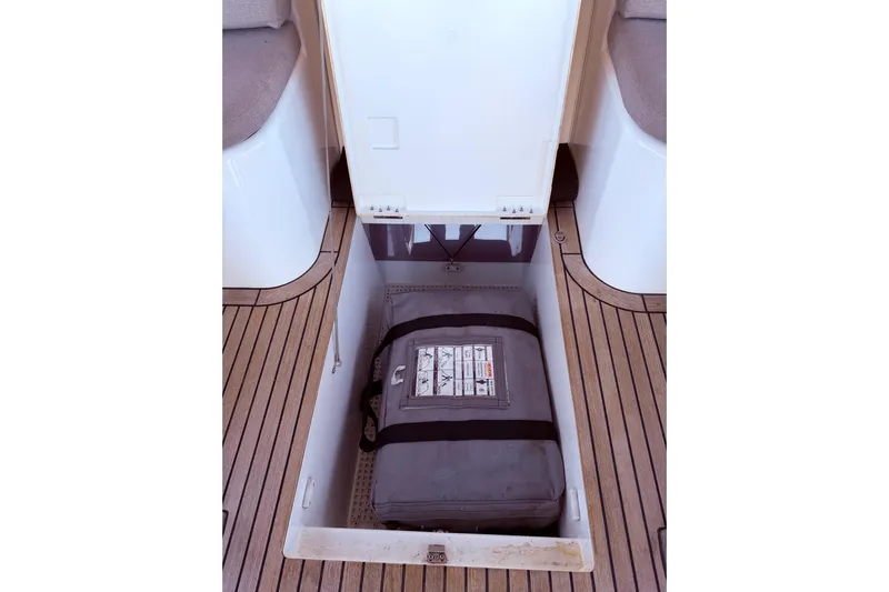 One Five Yacht Photos Pics Storage compartment on 2022 Beneteau Oceanis Yacht 54 with safety equipment.