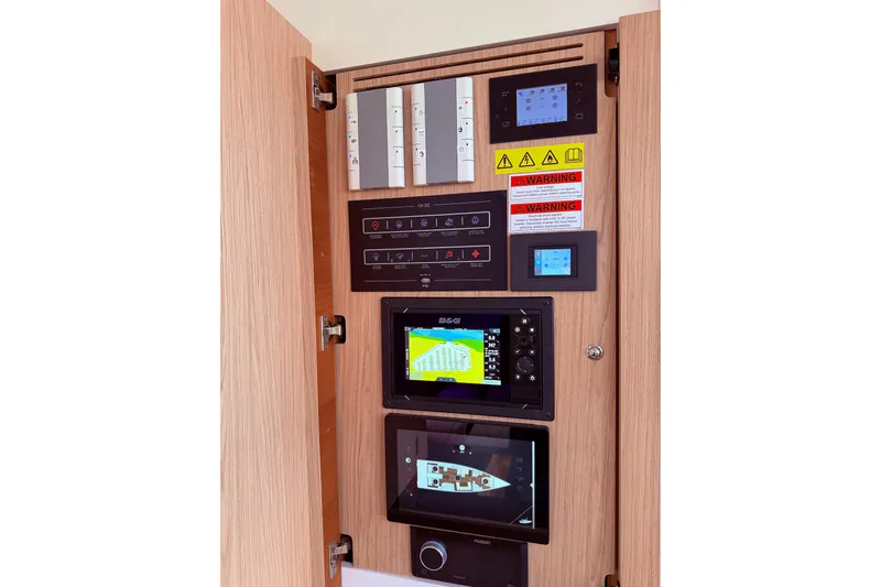 One Five Yacht Photos Pics Control panel of 2022 Beneteau Oceanis Yacht 54 with navigation and warning displays.