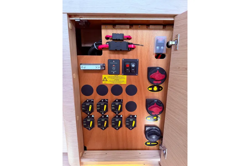 One Five Yacht Photos Pics Electrical panel inside 2022 Beneteau Oceanis Yacht 54, featuring switches and controls.
