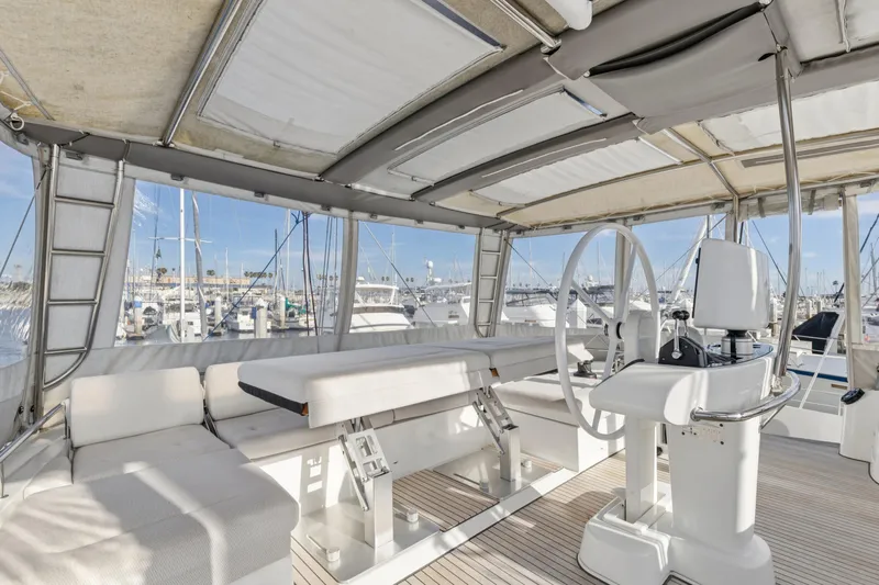 Second Wind Yacht Photos Pics Interior view of 2022 Lagoon 52 F yacht with helm and seating area.