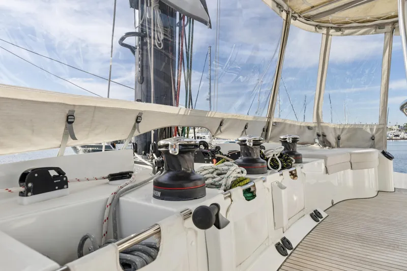 Second Wind Yacht Photos Pics 2022 Lagoon 52 F yacht deck with winches and seating area.
