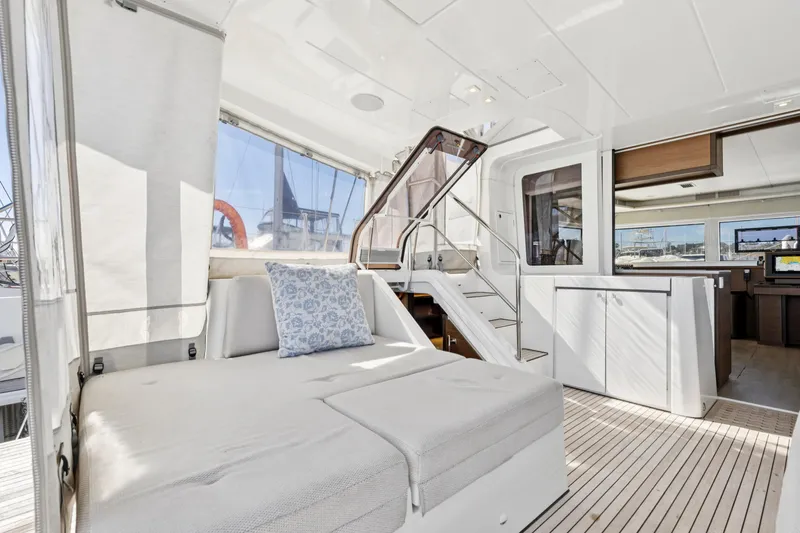 Second Wind Yacht Photos Pics Luxurious interior of 2022 Lagoon 52 F catamaran with modern furnishings and spacious layout.