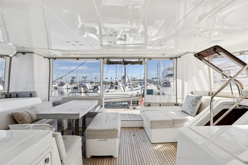 Second Wind Yacht Photos Pics Luxurious interior of 2022 Lagoon 52 F yacht with marina view.