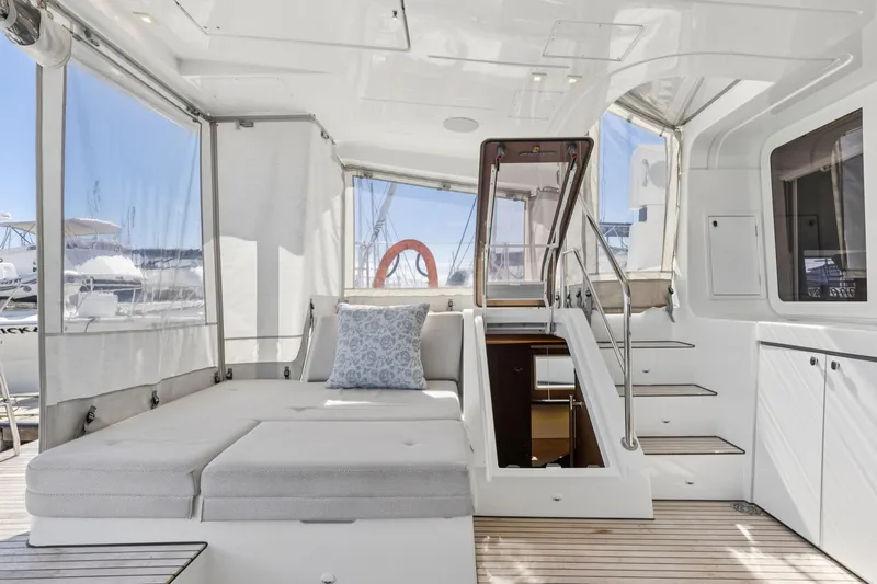 Second Wind Yacht Photos Pics Luxurious interior of 2022 Lagoon 52 F yacht with comfortable seating and modern design.