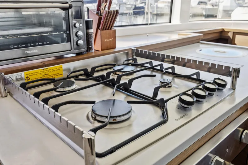 Second Wind Yacht Photos Pics Modern kitchen stove and oven on 2022 Lagoon 52 F yacht.