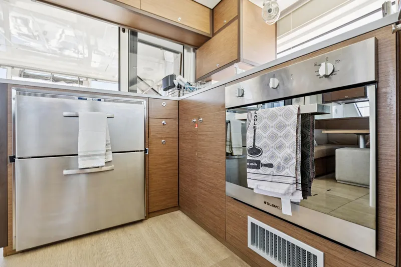 Second Wind Yacht Photos Pics Modern kitchen in 2022 Lagoon 52 F yacht with stainless steel appliances.