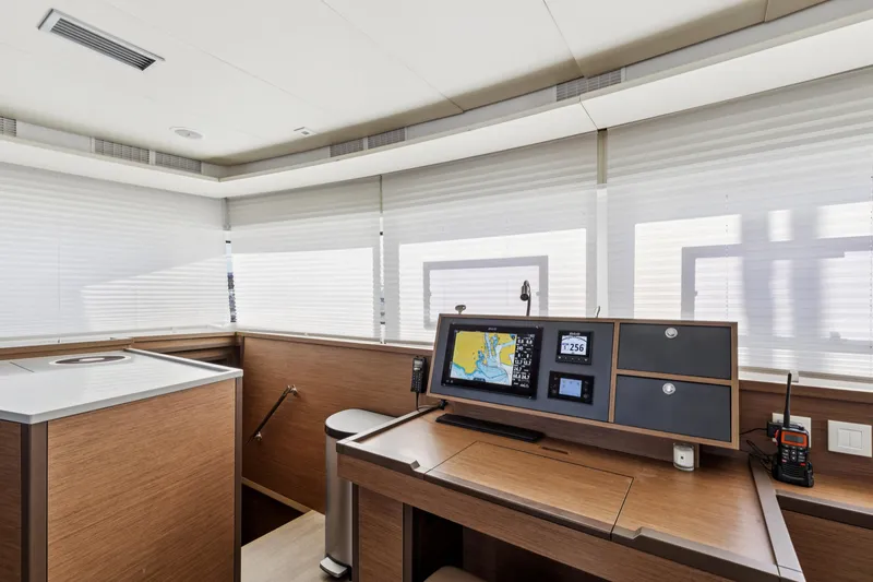 Second Wind Yacht Photos Pics Modern navigation station on 2022 Lagoon 52 F yacht with advanced equipment and sleek design.