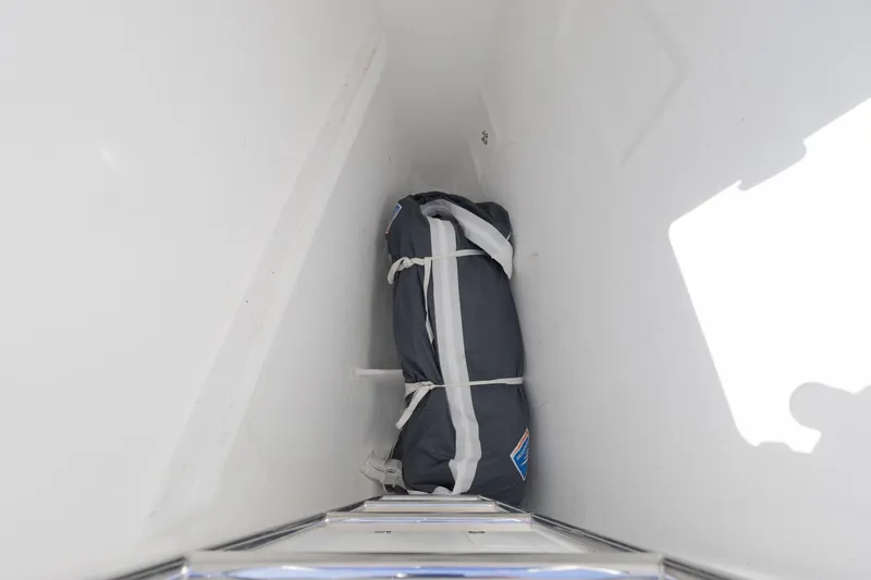 Second Wind Yacht Photos Pics Storage compartment on 2022 Lagoon 52 F yacht with secured bag inside.