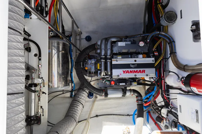 Second Wind Yacht Photos Pics Engine room of 2022 Lagoon 52 F catamaran with Yanmar engine and complex wiring.