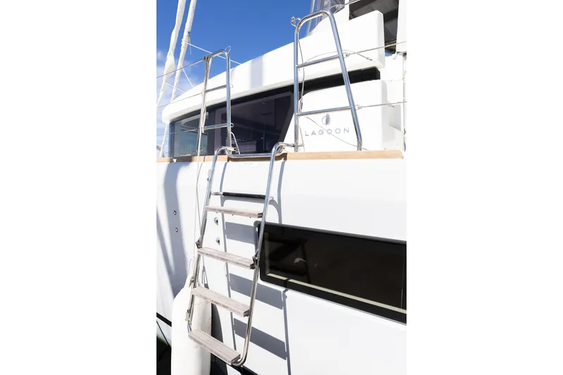 Second Wind Yacht Photos Pics 2022 Lagoon 52 F yacht with stainless steel ladder and sleek design.